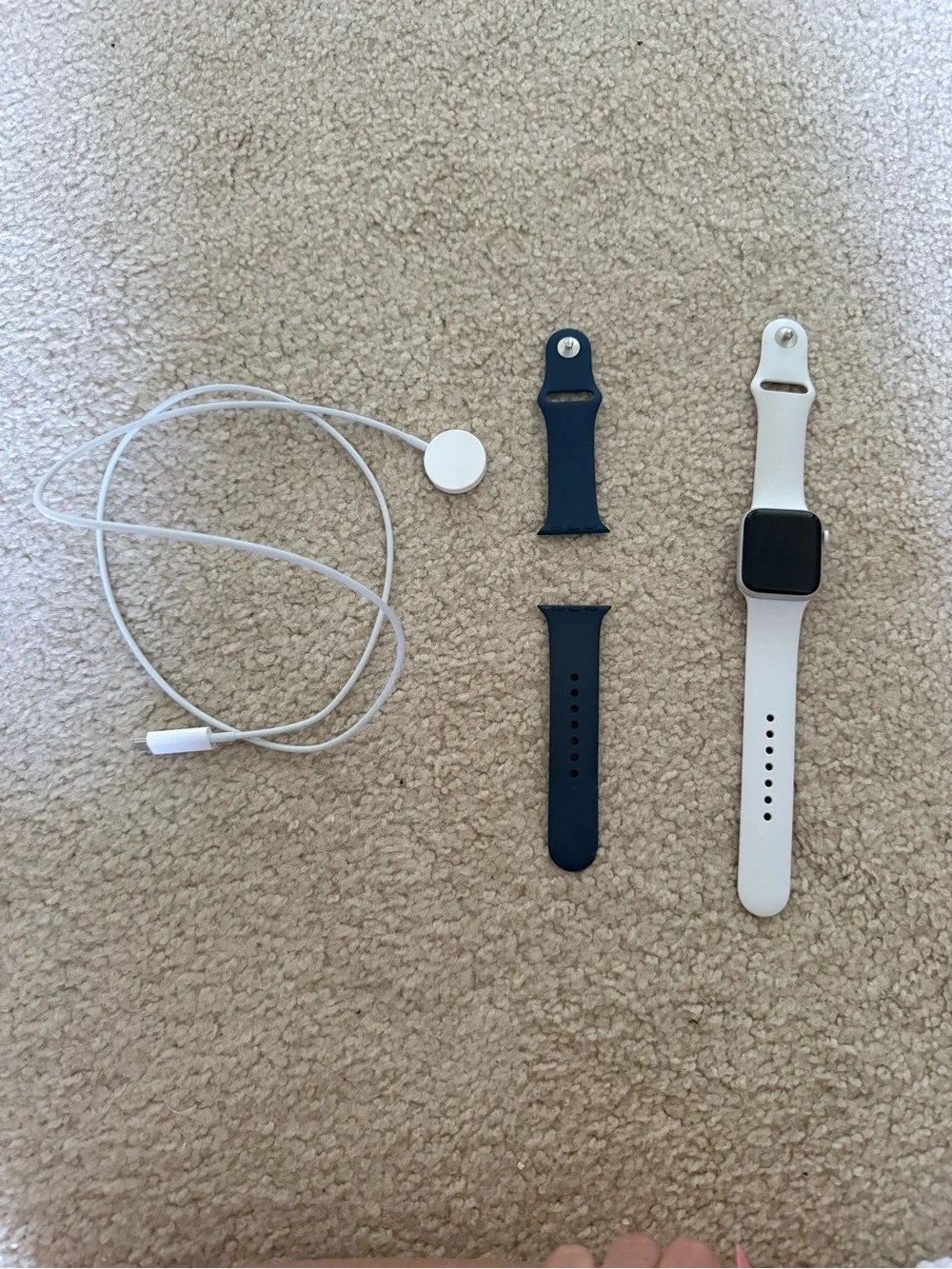White Smartwatch with Extra Navy Band and Charger